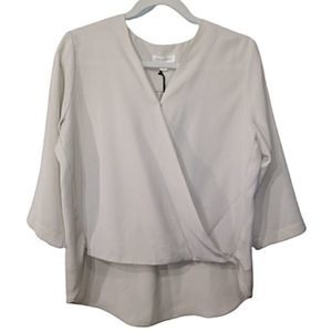Prologue wrap style blouse in cream. Size small